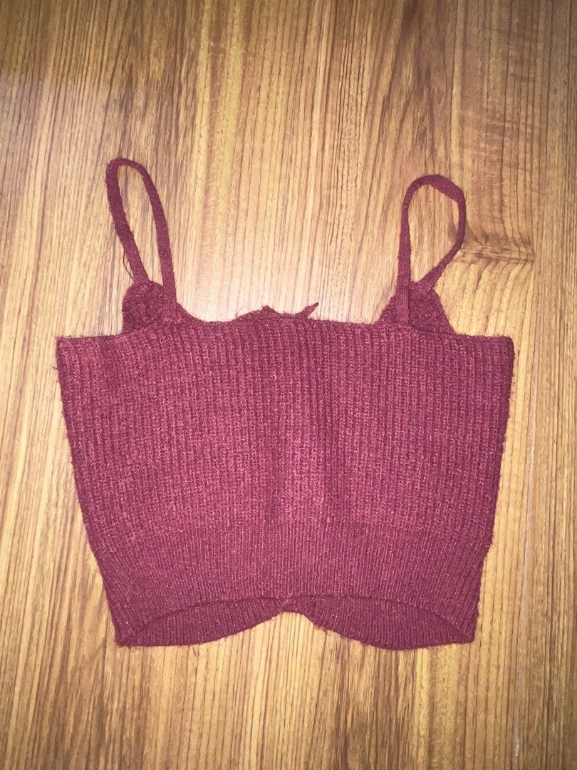 Maroon Knit Crop Top Camisole with Buttons (Category: Sleeveless) located in Marikina City. Submitted by owloui (Listing ID 1465319293, Image 2). Description: rfs: decluttering ‼️ NO COD Color: Maroon (will fit xs-s) Condition: Brand new (only used once for an event) Style: Sleeveless crop top with thin straps and Front button-up with cute white floral-shaped buttons Material: Soft textured knit fabric with ribbed hem.