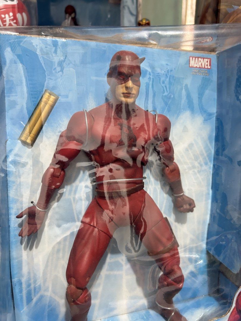 RUSH SALE !!! Marvel Daredevil 12 Inch Poseable Action Figure Boxed (Category: Figurines & Statues) located in Muntinlupa City. Submitted by capitalrg (Listing ID 1465238251, Image 2). Description: - 12-inch poseable Marvel Daredevil action figure in dynamic wired pose - never been played / NEW - Box shows noticeable wear and tear around the edges and corners.