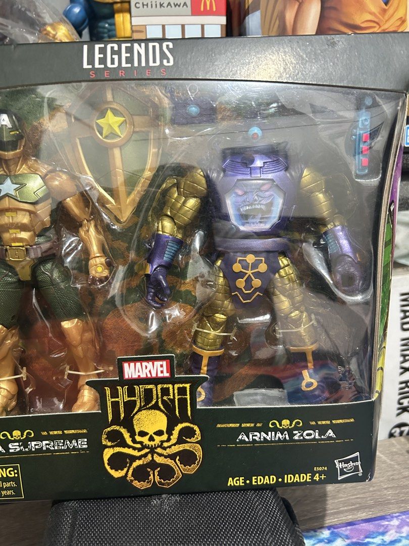 Marvel Legends Hydra Supreme and Arnim Zola 2-Pack (Category: Figurines & Statues) located in Muntinlupa City. Submitted by capitalrg (Listing ID 1465239233, Image 2). Description: - Brand: Hasbro Marvel Legends Series - Included Figures: Hydra Supreme and Arnim Zola - Accessories: Includes Hydra shield and more - Condition: Brand new, unopened in original window box - Perfect for: Marvel collections and display.