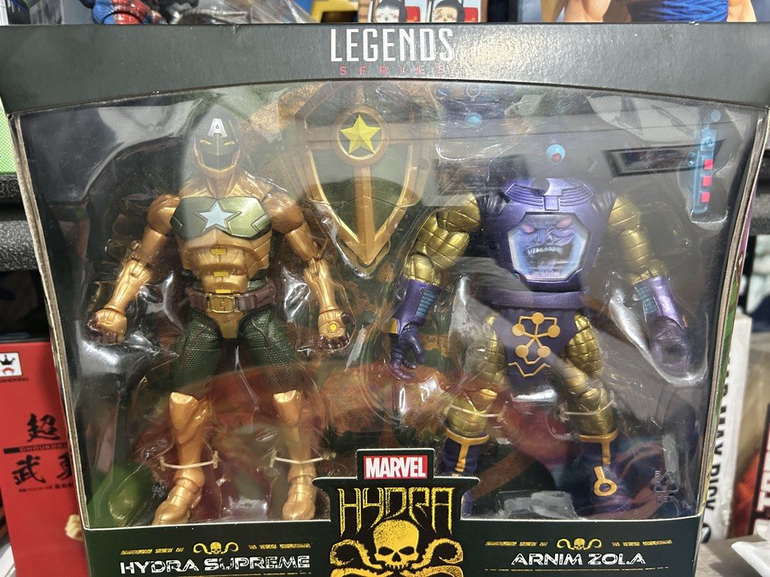 Marvel Legends Hydra Supreme and Arnim Zola 2-Pack (Category: Figurines & Statues) located in Muntinlupa City. Submitted by capitalrg (Listing ID 1465239233, Image 3). Description: - Brand: Hasbro Marvel Legends Series - Included Figures: Hydra Supreme and Arnim Zola - Accessories: Includes Hydra shield and more - Condition: Brand new, unopened in original window box - Perfect for: Marvel collections and display.