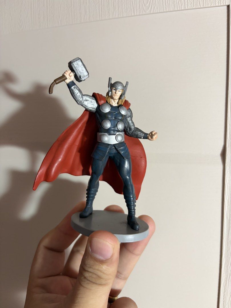 Marvel Thor Figurine Disney Action Figure (Category: Figurines & Statues) located in Plaridel. Submitted by moddedjarvis (Listing ID 1465171675, Image 1). Description: - Official Disney & Marvel collectible Thor figurine - Equipped with iconic red cape, winged helmet, and Mjolnir - Dynamic standing pose holding the hammer high - Intricate paint details on the armor, face, and hair - Sturdy solid plastic build - Stands on a grey circular base with