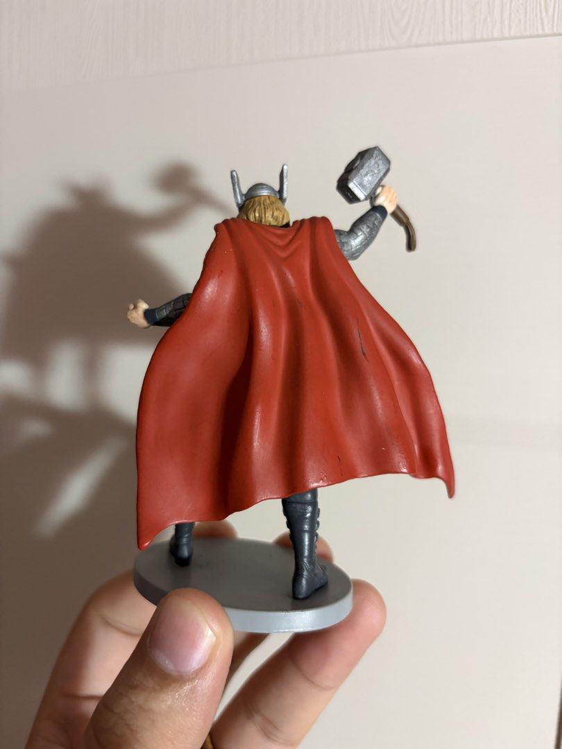 Marvel Thor Figurine Disney Action Figure (Category: Figurines & Statues) located in Plaridel. Submitted by moddedjarvis (Listing ID 1465171675, Image 2). Description: - Official Disney & Marvel collectible Thor figurine - Equipped with iconic red cape, winged helmet, and Mjolnir - Dynamic standing pose holding the hammer high - Intricate paint details on the armor, face, and hair - Sturdy solid plastic build - Stands on a grey circular base with