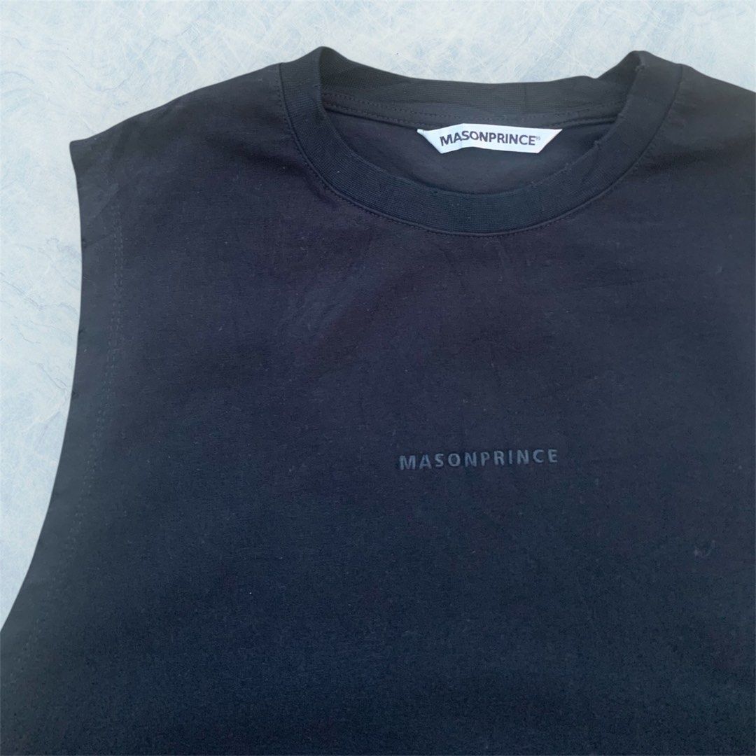 MASONPRINCE ARCHIVED TANK TOP (Category: Sleeveless) located in Paranaque City. Submitted by lesstash001 (Listing ID 1465295129, Image 3). Description: - Brand: MASONPRINCE - Color: Solid black - Fit: Relaxed fit with round ribbed collar - Details: large white graffiti lettering on upper back - Size: Size 1 tag with washing instructions - Material: Clean cotton fabric FIT ON LARGE 22 WIDTH 28 LENGTH IN EXCELLENT TO NEW CONDITION.