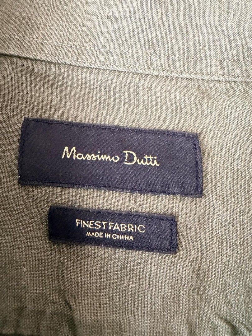 Massimo Dutti Green Long Sleeve Shirt (Category: Tshirts & Polo Shirts ) located in Makati City. Submitted by tzissle (Listing ID 1465171666, Image 2). Description: - Brand: Massimo Dutti (Premium Spanish brand) - Color: Sage green - Design: Classic collar, front button closure, and two chest flap pockets - Sleeves: Long sleeves - Material: Finest quality fabric - Condition: Clean and well-maintained - Style: Versatile for casual or dressed-up lo