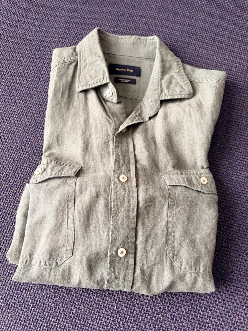 Massimo Dutti Green Long Sleeve Shirt (Category: Tshirts & Polo Shirts ) located in Makati City. Submitted by tzissle (Listing ID 1465171666, Image 1). Description: - Brand: Massimo Dutti (Premium Spanish brand) - Color: Sage green - Design: Classic collar, front button closure, and two chest flap pockets - Sleeves: Long sleeves - Material: Finest quality fabric - Condition: Clean and well-maintained - Style: Versatile for casual or dressed-up lo
