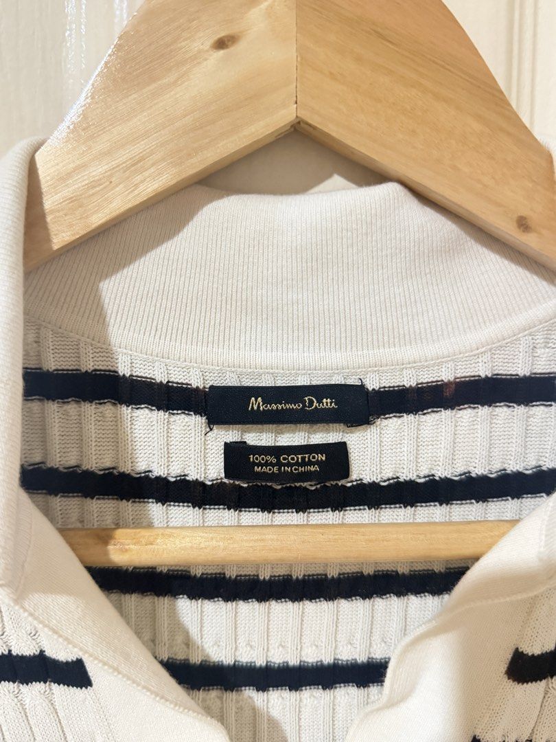 Massimo Dutti Striped Knit Polo Shirt (Category: Tshirts & Polo Shirts ) located in Manila. Submitted by ktyyycloset (Listing ID 1465319235, Image 3). Description: - Brand: Massimo Dutti - Design: Black & white horizontal stripes with V-neck collar and short sleeves - Material: 100% cotton ribbed knit (Made in China) - Condition: Pre-loved with a couple of small brown stains near the neckline and upper back area - Perfect for smart-casual styling