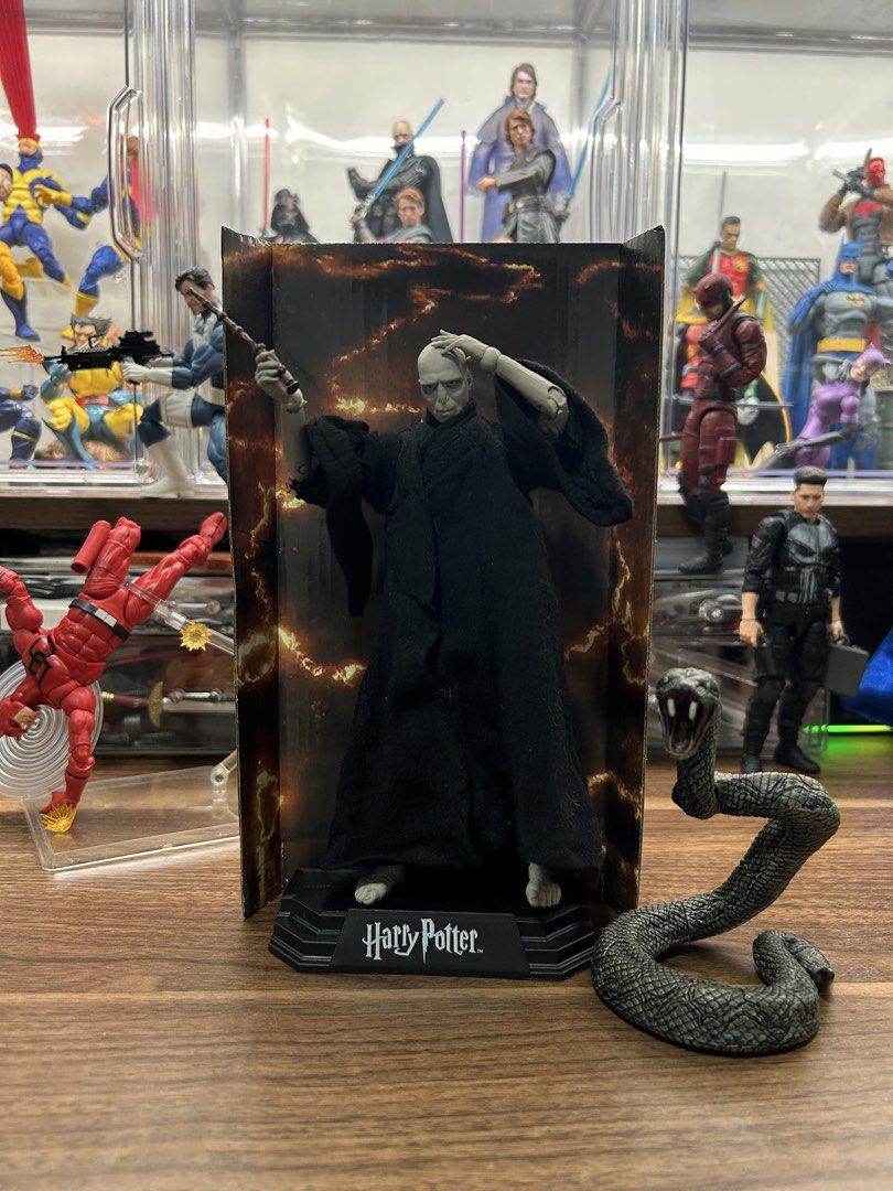 McFarlane Harry Potter Wizarding World Lord Voldemort (Category: Figurines & Statues) located in Davao. Submitted by haallouu (Listing ID 1465277590, Image 3). Description: Condition: BiB Issue: tattered soft goods on left elbow Comes with Base, Backdrop + support, Nagini.