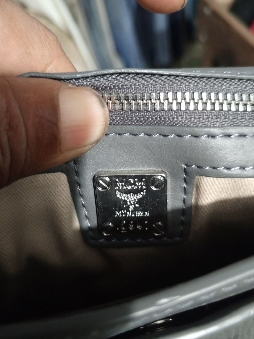 MCM Black Monogram Leather Chain Crossbody Bag (Category: Luxury Bags & Wallets) located in Caloocan City. Submitted by grandhorse-c5575b (Listing ID 1465214488, Image 2). Description: - Authentic MCM black leather crossbody bag with all-over monogram print - Elegant silver-tone hardware and matching chain strap - Secure front flap closure with metal lock - Fabric-lined interior featuring a convenient zip pocket - MCM München branding and product