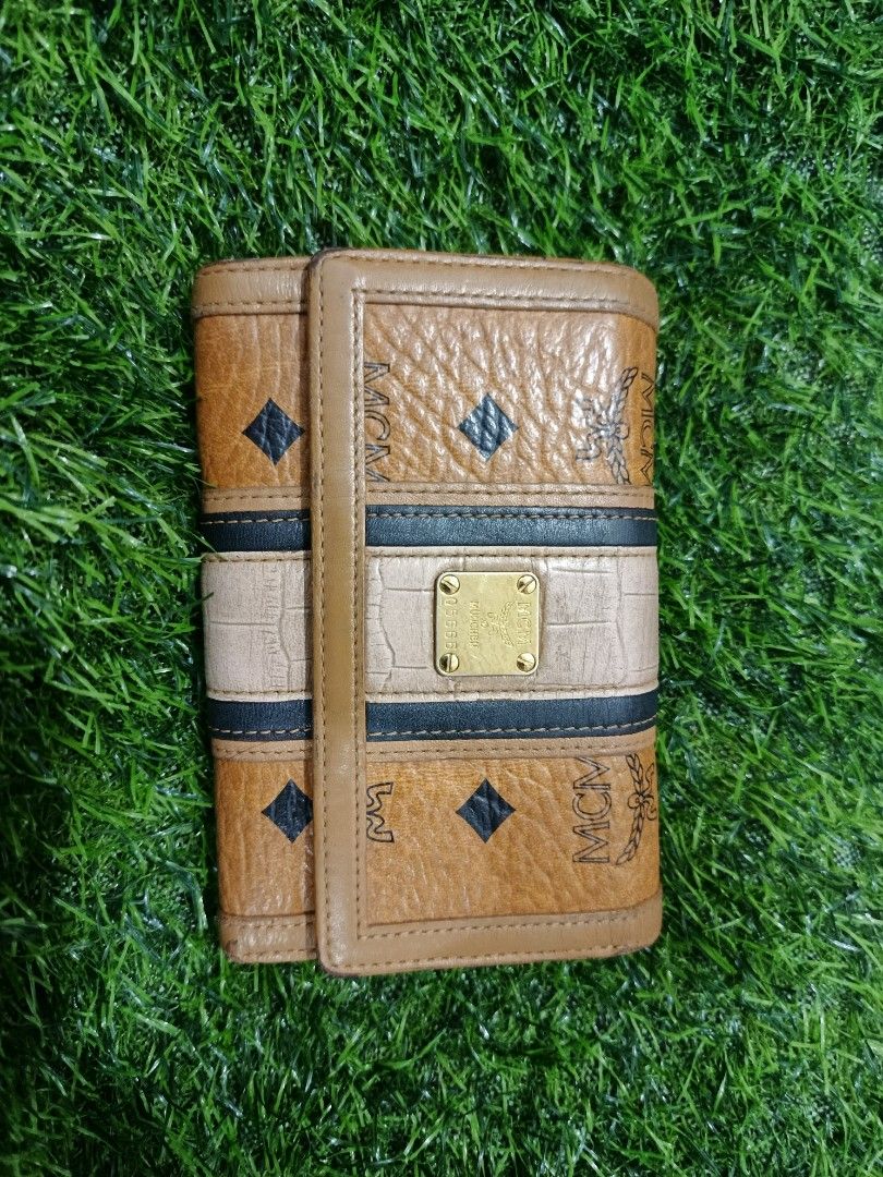 MCM cognac med size (Category: Luxury Bags & Wallets) located in Manticao. Submitted by jiachloeyana (Listing ID 1465324637, Image 1). Description: in good condition medium trifold.