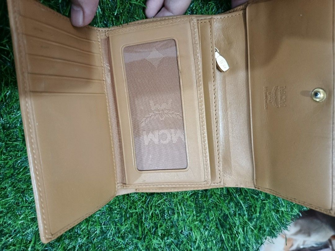 MCM cognac med size (Category: Luxury Bags & Wallets) located in Manticao. Submitted by jiachloeyana (Listing ID 1465324637, Image 3). Description: in good condition medium trifold.