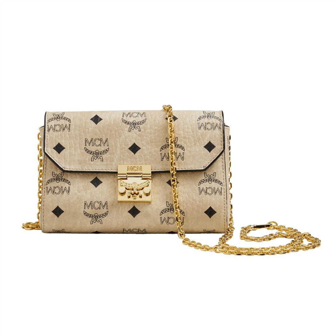 MCM Visetos Monogram Crossbody Chain Bag Beige (Category: Luxury Bags & Wallets) located in Caloocan City. Submitted by grandhorse-c5575b (Listing ID 1465214316, Image 1). Description: - Authentic MCM Crossbody Bag - Classic beige monogram print with gold-tone hardware - Structured flap design with secure closure - Compact size, ideal for daily essentials and light travel - Interior features fabric lining, zip pocket, and official branded serial 