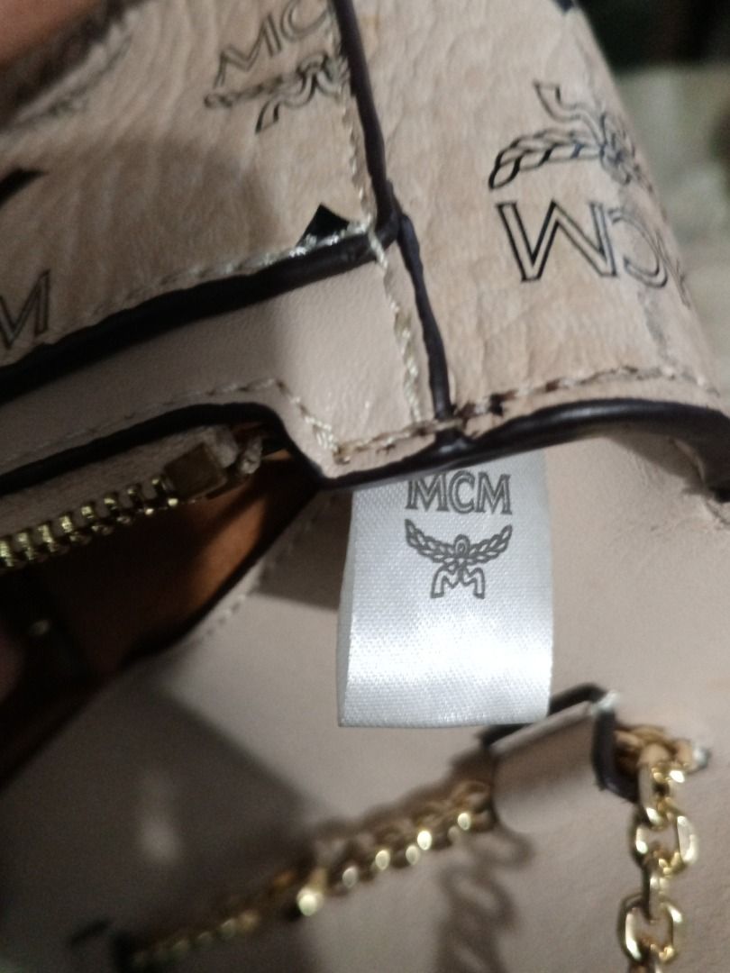 MCM Visetos Monogram Crossbody Chain Bag Beige (Category: Luxury Bags & Wallets) located in Caloocan City. Submitted by grandhorse-c5575b (Listing ID 1465214316, Image 3). Description: - Authentic MCM Crossbody Bag - Classic beige monogram print with gold-tone hardware - Structured flap design with secure closure - Compact size, ideal for daily essentials and light travel - Interior features fabric lining, zip pocket, and official branded serial 
