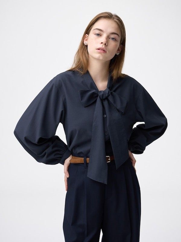 Medium GU (Category: Others Tops) located in Castillejos. Submitted by lalainecloset22 (Listing ID 1465242074, Image 1). Description: - Brand: GU - Size: Medium (160/84A) - Color: Dark Navy Blue - Material: 100% Polyester (59% recycled polyester fiber) - Features: Elegant tie-neck bow, trendy puff sleeves, smooth fabric - Condition: Excellent (Layered Condition 4) - Perfect for: Office wear, formal events, or smart-casual OOTDs.