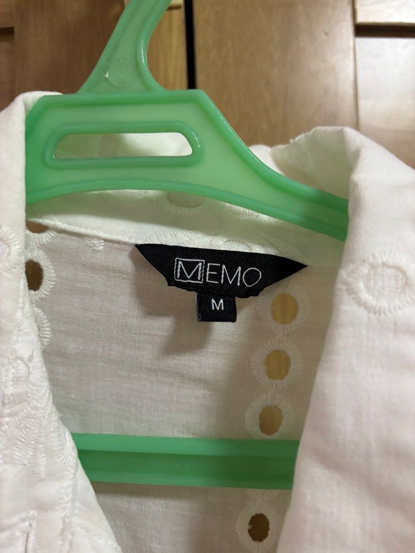 MEMO White Eyelet Button-Up Blouse Size M (Category: Blouses) located in Cebu City. Submitted by teveschels38656 (Listing ID 1465334099, Image 2). Description: - Brand: MEMO - Size: Medium to Large - Design: Short sleeves, lapel collar, and front button closure - Details: All-over eyelet embroidery with cut-out floral patterns - Fit: Relaxed fit and lightweight material - Condition: Excellent.
