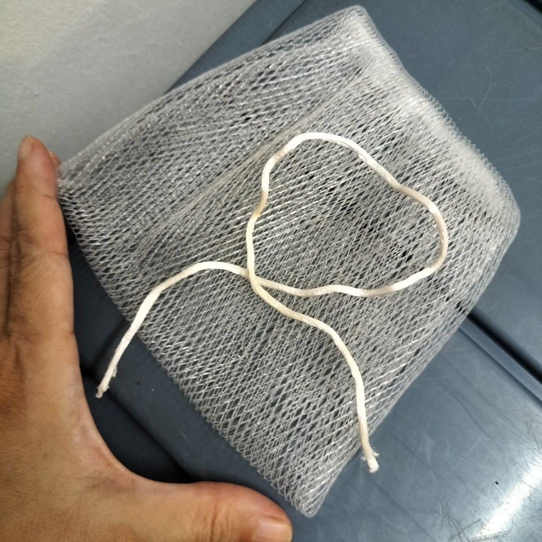 Mesh soap pouch with drawstring (Category: Purses & Pouches) located in Paranaque City. Submitted by decluttering-all (Listing ID 1465173183, Image 2). Description: - Material: Soft textured netting - Color: White with a secure drawstring closure - Features: Keeps soap dry between uses, creates a rich lather, and easy to hang in the shower - Perfect simple bathroom accessory for everyday use decluttering pick up beside Toyota bicutan paranaque .