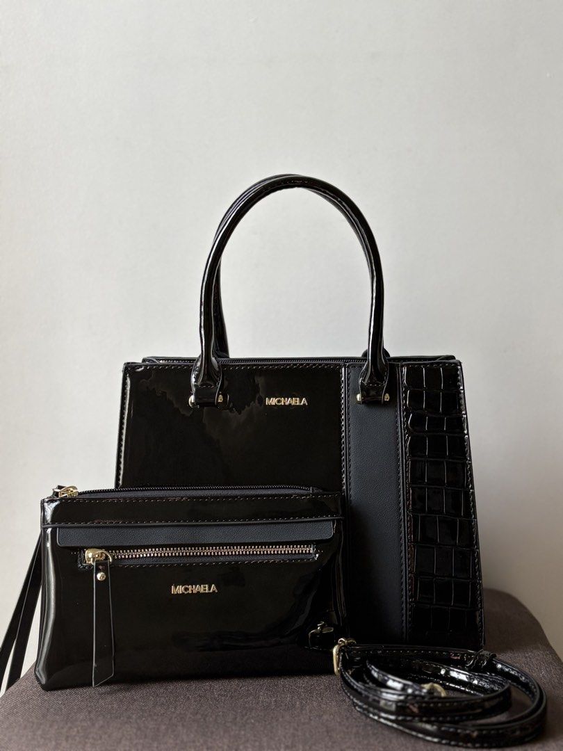 MICHAELA Crocodile Handbag | Black (Category: Purses & Pouches) located in Manila. Submitted by thecloseteditph (Listing ID 1465258185, Image 2). Description: Authentic MICHAELA Crocodile Structured Handbag • Black color • Crocodile-effect patent finish • Structured design • Gold-tone hardware • Top handle • Comes with matching pouch & detachable strap • Clean and well-maintained • Excellent pre-owned condition • No major flaws 📌 Handbag + match