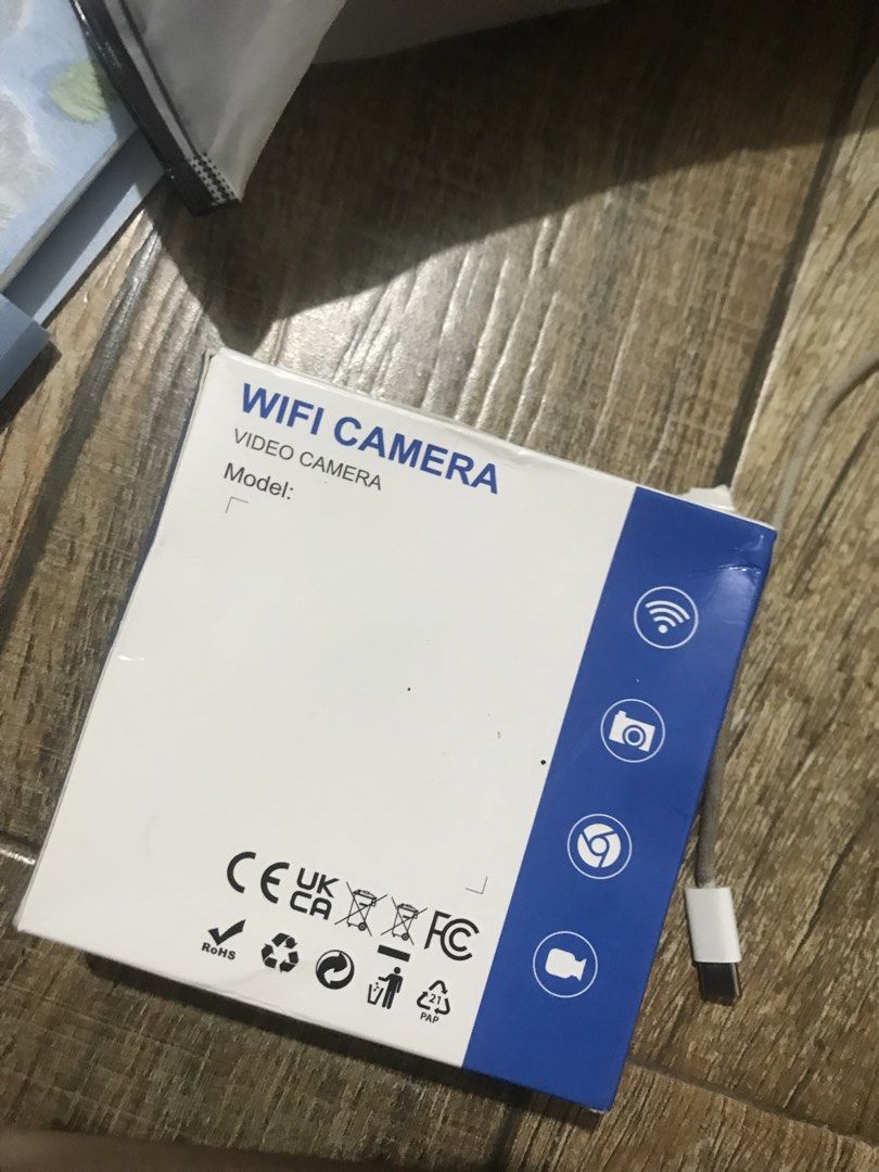 Mini WiFi IP Video Camera V720 (Category: Security Systems & CCTV Cameras) located in Manila. Submitted by itsmeyowwwww (Listing ID 1465224106, Image 2). Description: - Product: Mini WiFi IP Video Camera (Black) - App: Easy setup using V720 app (QR code in manual) - Features: On/off switch, charging port, and SD card slot - Condition: Brand new, unused contents in original molded plastic tray - In the Box: Camera, user manual, and charging cable.