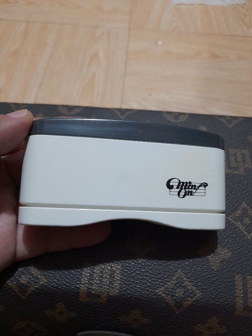 Min-On Binocular Viewer Japanese Warning (Category: Sunglasses & Eyewear) located in Bocaue. Submitted by marajapansurplus (Listing ID 1465312046, Image 2). Description: - Brand/Model: Min-On compact optical viewer - Color: White body with dark grey eyepieces - Design: Handheld, portable, and clean exterior with clear markings - Safety: Japanese text warning on the eyecup states 'Do not look at the sun' - Condition: Excellent, clean exterior with