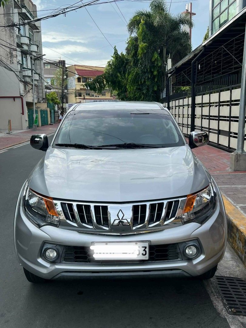 Mitsubishi Strada GLX V Auto (Category: Used Cars) located in Makati City. Submitted by mike755 (Listing ID 1465305544, Image 2). Description: Color: Silver -Odometer: 83k km -2477 cc Turbo intercooler VGT 4x2 178PS 400NM 5AT Italian Synthetic Leather Seats from MG Square Changed oil fully synthetic, ATF, gear oil. Changed rear shocks, Yokohama GeolandarTires at 85%. Chnaged timing belt and related accesories New Battery With rear cover and bed c