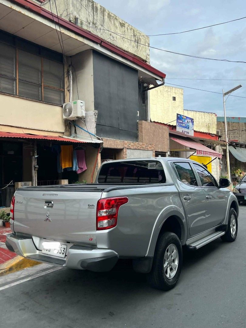 Mitsubishi Strada GLX V Auto (Category: Used Cars) located in Makati City. Submitted by mike755 (Listing ID 1465305544, Image 3). Description: Color: Silver -Odometer: 83k km -2477 cc Turbo intercooler VGT 4x2 178PS 400NM 5AT Italian Synthetic Leather Seats from MG Square Changed oil fully synthetic, ATF, gear oil. Changed rear shocks, Yokohama GeolandarTires at 85%. Chnaged timing belt and related accesories New Battery With rear cover and bed c