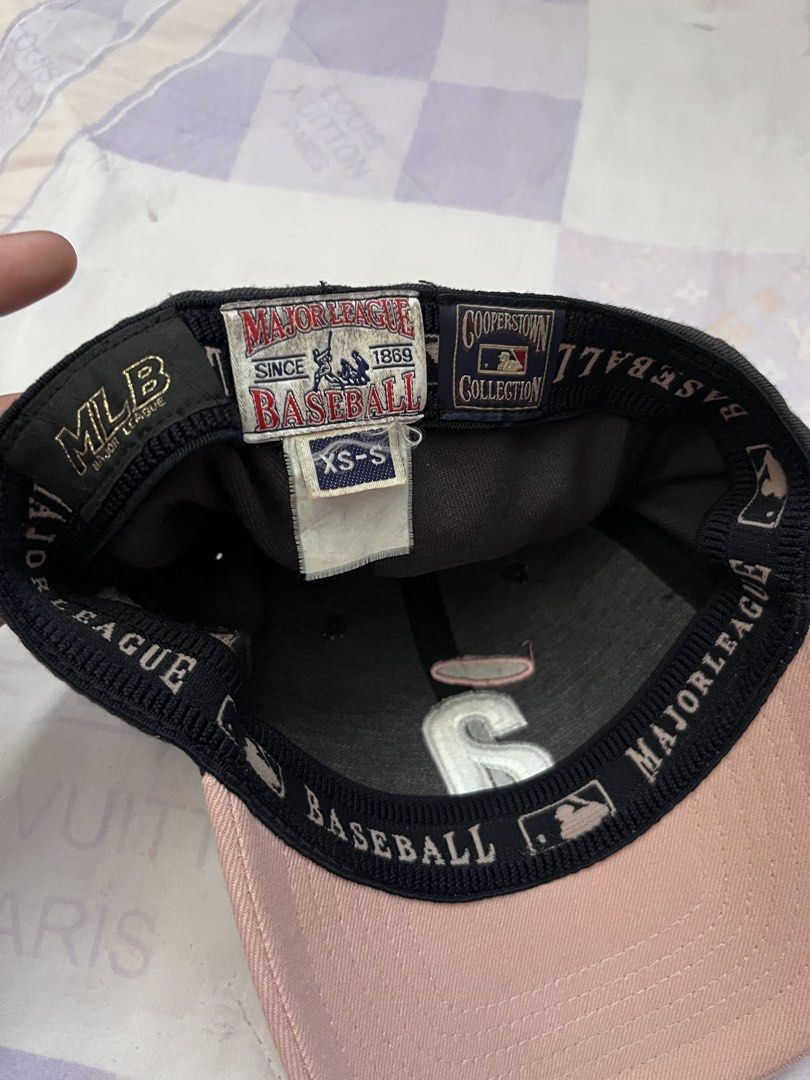 MLB Cooperstown Collection Los Angeles Angels Cap (Category: Caps & Hats) located in Puerto Princesa. Submitted by dijaydj28 (Listing ID 1465325532, Image 3). Description: - Authentic MLB Cooperstown Collection cap - Color: Black crown with a stylish pink brim - Front design: Embroidered Angel letter 'A' logo with halo detail - Size: XS-S (Classic fitted style) - Interior: Features official Major League Baseball branded sweatband and tags - Condi
