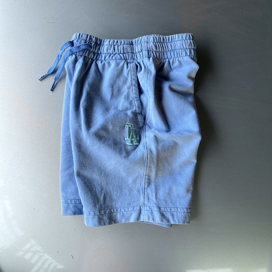 MLB Los Angeles Dodgers Blue Sweatshorts (Category: Babies & Kids Fashion) located in Mandaue City. Submitted by chinsyap_03 (Listing ID 1465302487, Image 3). Description: - Brand: MLB (Los Angeles Dodgers) - Color: Light Blue - Size: 110 - Features: Embroidered LA logo near front pocket, small MLB patch on back right hip - Comfort: Elastic waistband with adjustable drawstring - Pockets: Two functional side pockets - Condition: Brand new / Excell