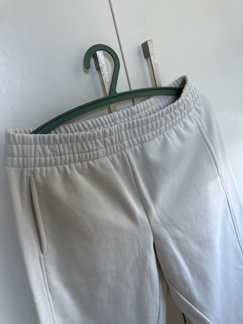 MNG White Sweatpants Size M (Category: Joggers) located in Pasig City. Submitted by kdcloset_2021 (Listing ID 1465380513, Image 2). Description: - Brand: MNG - Size: EUR/USA M, MEX M - Color: White - Fit: Straight leg with chic vertical seam details - Features: Comfortable elastic waistband, 2 side pockets - Origin: Made in Bangladesh.