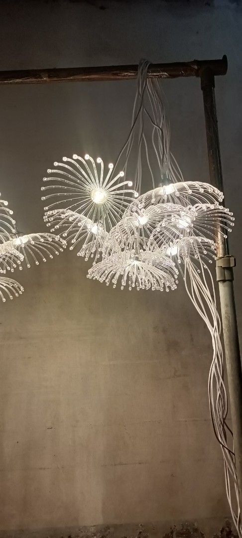 Modern LED firework cluster pendant light chandelier (Category: Lighting) located in Manila. Submitted by keenwind_552523 (Listing ID 1465373192, Image 3). Description: - Unique cluster of glowing acrylic flower-like pendant lights - Emits a bright white light pattern through dozens of delicate curved stems - Fully wired and tested, 100% operational - Suspended by clean white cords - Perfect statement piece for dining areas or rooms with high cei