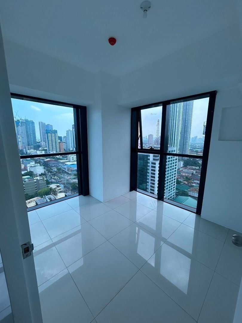 Modern rooftop infinity pool with city skyline views (Category: Apartments & Condos) located in Caloocan City. Submitted by mj_theelements (Listing ID 1465185342, Image 2). Description: - High floor rooftop location - Stunning city skyline views - Long lap pool with blue tiles - Sun loungers on the deck - Perfect for swimming and relaxing.