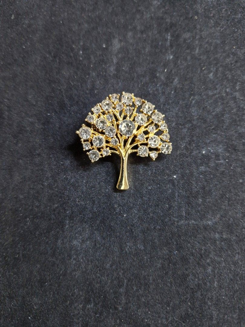 Money Tree Brooch 4 (Category: Brooches) located in Taguig. Submitted by mommaschoice (Listing ID 1465341567, Image 1). Description: Brand New Adorned w/ clear rhinestones Gold-Tone finish Lightweight won't damage the fabric Ships nationwide.