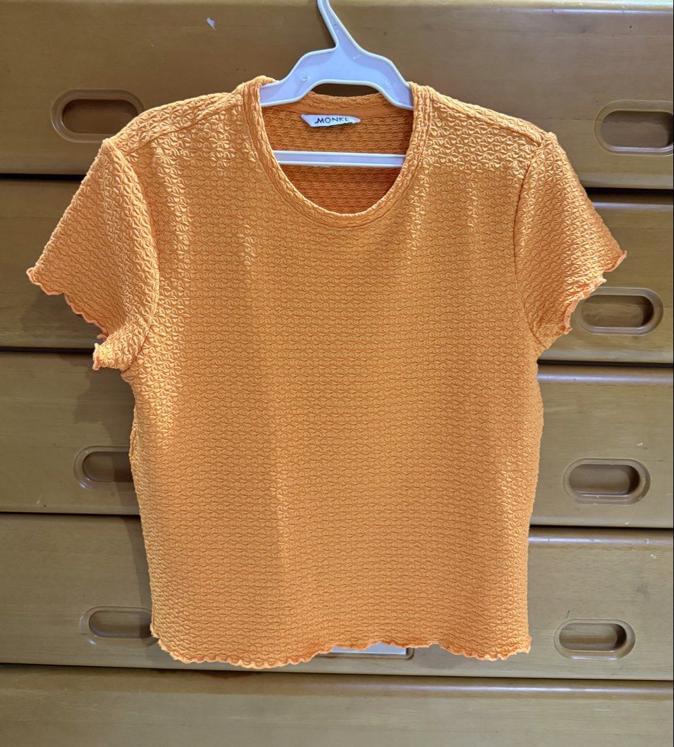 Monki Orange Textured Short Sleeve Top (Category: Shirts) located in General Santos City (Dadiangas). Submitted by pina_cxladah (Listing ID 1465288338, Image 1). Description: - Brand: Monki - Size: S - Color: Bright orange - Fabric: Lightweight with a crinkled texture - Design: Crew neckline, short sleeves, and trendy lettuce hem details on cuffs and bottom.