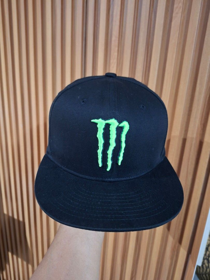 Monster Energy Snapback Cap Black and Green (Category: Caps & Hats) located in Cebu City. Submitted by anton_delos_reyes (Listing ID 1465201639, Image 1). Description: - Color: Sleek black with bold lime green Monster Energy claw embroidery on front and back - Fit: Standard adult fit with an adjustable strap closure for custom sizing - Design: Structured panels with a stylish flat brim - Condition: Clean fabric, well-maintained, and ready to wear