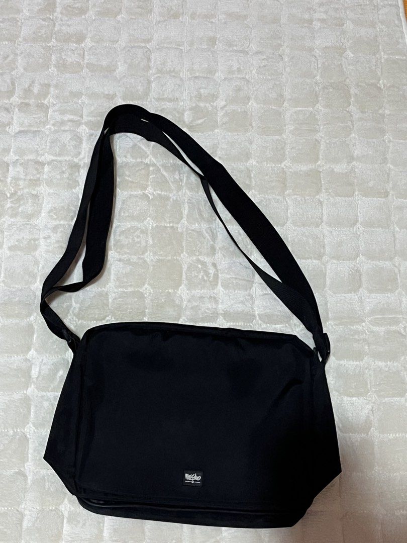 Mossimo Black Crossbody Messenger Bag (Category: Sling Bags) located in Dasmarinas. Submitted by gmxngmmd (Listing ID 1465359688, Image 3). Description: Black Mossimo Crossbody Messenger Bag - Black Mossimo messenger bag with adjustable strap - Multiple compartments inside, including pen slots and zippered pockets. - Front flap with velcro closure and small logo patch. - Clean interior lining. - Practical everyday size for school, work, or casual