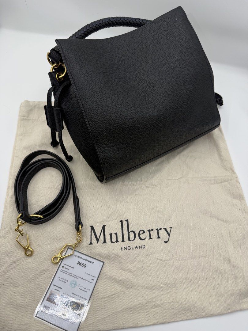 Mulberry (Category: Cross-body Bags) located in Caloocan City. Submitted by rossvault2 (Listing ID 1465239155, Image 3). Description: Mulberry black textured leather bag featuring a gold-tone ring lock closure and braided top handle. Includes a detachable shoulder strap, dust bag, and a Poizon authentication pass card dated August 2026. Clean interior and exterior. Ready to use. -normal signs of use please see pics.