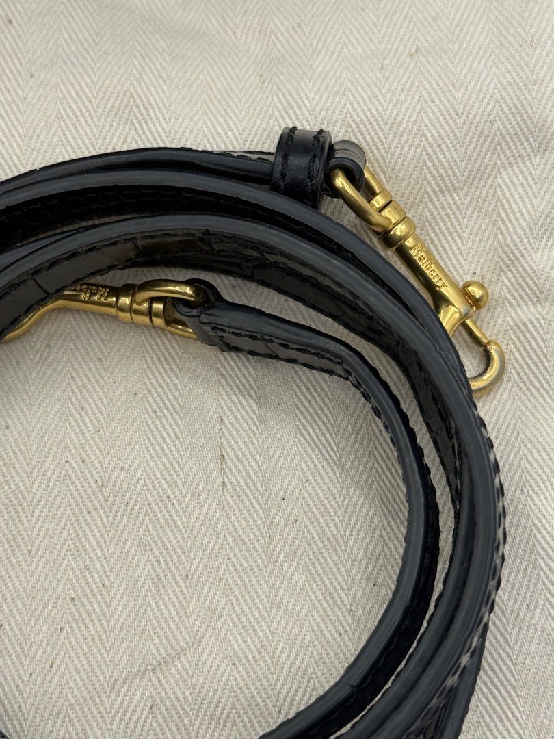 Mulberry (Category: Cross-body Bags) located in Caloocan City. Submitted by rossvault2 (Listing ID 1465240051, Image 2). Description: - Authentic Mulberry handbag in black leather - Glossy croc-embossed finish with gold-tone hardware - Signature ring lock closure on front flap - Versatile top handle and matching adjustable leather crossbody strap -no dustbag - Pristine exterior and clean interior condition.