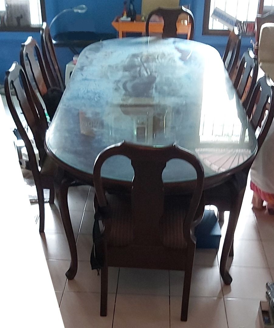 Narra 10-seater long dining table (Category: Everything Else Others) located in Quezon City. Submitted by low-ballers_will_be_blocked (Listing ID 1465226063, Image 1). Description: mint solid heavy Narra wood with glass top and original mint upholstery. 2 host / head chairs. since 1978.