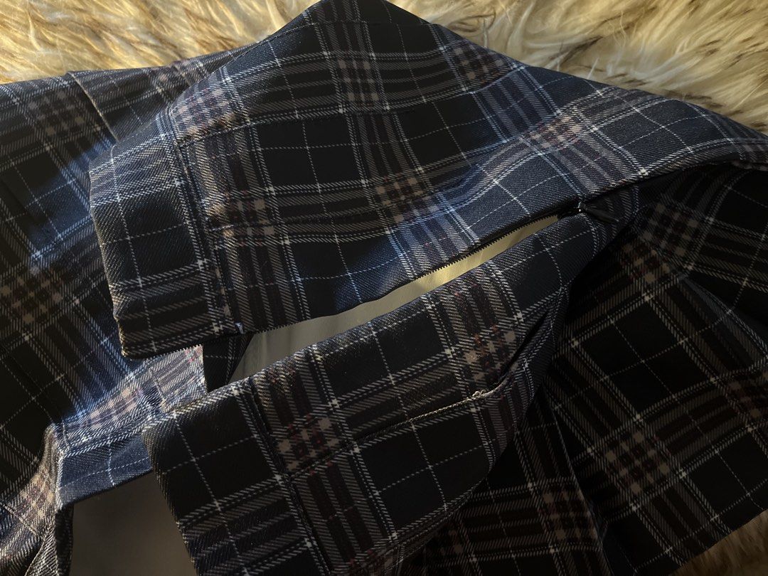 Navy Blue Plaid Pleated Skirt (Category: Skirts) located in Las Pinas. Submitted by francesaly (Listing ID 1465205436, Image 2). Description: - Style: Classic schoolgirl / dark academia - Design: Navy blue and brown plaid with all-around structured pleats - Fit: High-waist with a clean, flat waistband - Closure: Hidden side zipper for a seamless look - Pairing: Easily matches with basic tees, blouses, or oversized sweaters - Condition: Excellent 