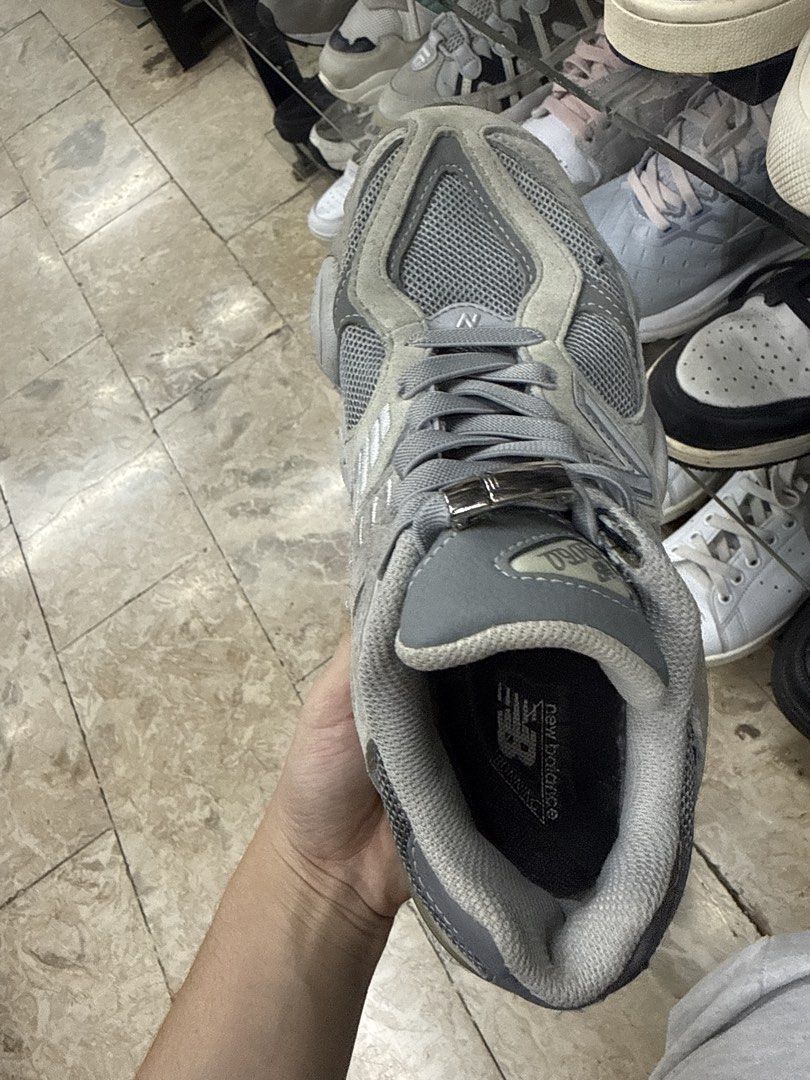 New Balance 9060 Grey Sneakers (Category: Sneakers) located in Abucay. Submitted by fastlion.584bdf (Listing ID 1465361866, Image 2). Description: - Model: New Balance 9060 - Colorway: Classic Grey - Material: Premium mesh and suede upper panels - Accessory: Includes attached lace lock - Condition: Heavy wear and scuffs on foam midsole, outsole, and heel blocks (priced accordingly) - Branding: Standard New Balance tongue and heel details.