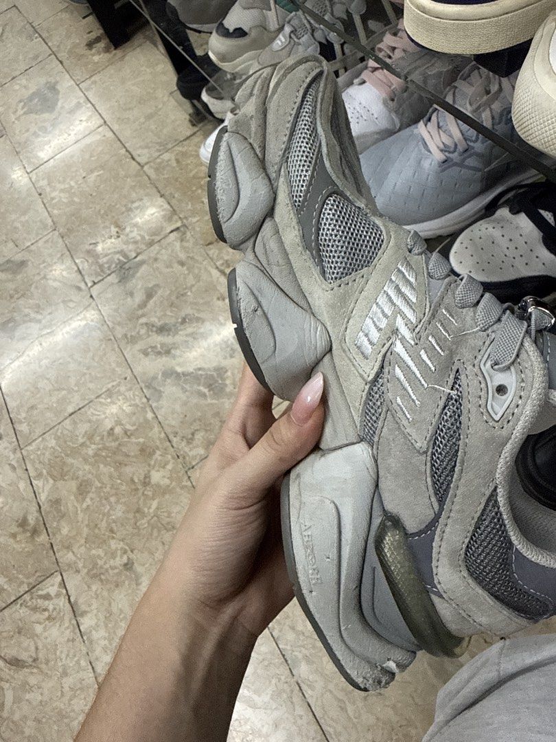 New Balance 9060 Grey Sneakers (Category: Sneakers) located in Abucay. Submitted by fastlion.584bdf (Listing ID 1465361866, Image 3). Description: - Model: New Balance 9060 - Colorway: Classic Grey - Material: Premium mesh and suede upper panels - Accessory: Includes attached lace lock - Condition: Heavy wear and scuffs on foam midsole, outsole, and heel blocks (priced accordingly) - Branding: Standard New Balance tongue and heel details.
