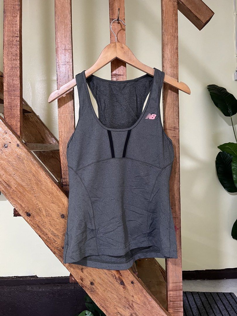 New Balance NB Dry Active Tank Top Grey (Category: Activewear) located in Carmen, Agusan del Norte. Submitted by all.en.thrifts (Listing ID 1465249773, Image 1). Description: - Grey New Balance active tank top - Features NB Dry technology and mesh panels for breathability - Racerback design with lightweight athletic fabric - Pink New Balance logo on the upper left chest - Perfect for workouts, running, and the gym.