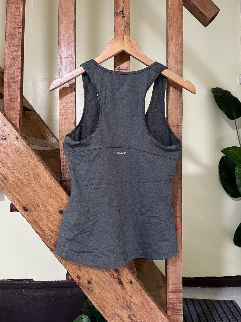 New Balance NB Dry Active Tank Top Grey (Category: Activewear) located in Carmen, Agusan del Norte. Submitted by all.en.thrifts (Listing ID 1465249773, Image 2). Description: - Grey New Balance active tank top - Features NB Dry technology and mesh panels for breathability - Racerback design with lightweight athletic fabric - Pink New Balance logo on the upper left chest - Perfect for workouts, running, and the gym.