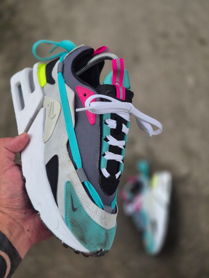 Nike Air Max furyoza (Category: Sneakers) located in Manila. Submitted by kushoenero (Listing ID 1465303020, Image 1). Description: - Brand: Nike Air Max - Colorway: Vibrant teal, pink, grey, and neon yellow panels - Materials: Mesh and suede upper construction with a chunky white foam midsole - Features: Pull tabs at the tongue and heel, white laces installed - Condition: Pre-owned with minor dirt marks on the suede toe box area.