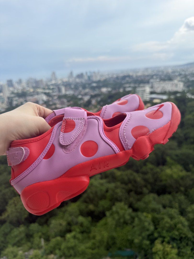 Nike Air Rift Dot Pink Red Split Toe Sneakers (Category: Sneakers) located in Cebu City. Submitted by irinaivyj (Listing ID 1465214447, Image 1). Description: - Brand: Nike Air Rift - Style: Split-toe / Tabi silhouette - Colorway: Pink and red with playful polka dots - Size: US 9 / UK 6.5 / EUR 40.5 - Features: Strap closure, chunky rubber sole with Air cushioning - Condition: Clean uppers and insoles, well-maintained - Perfect statement sneakers