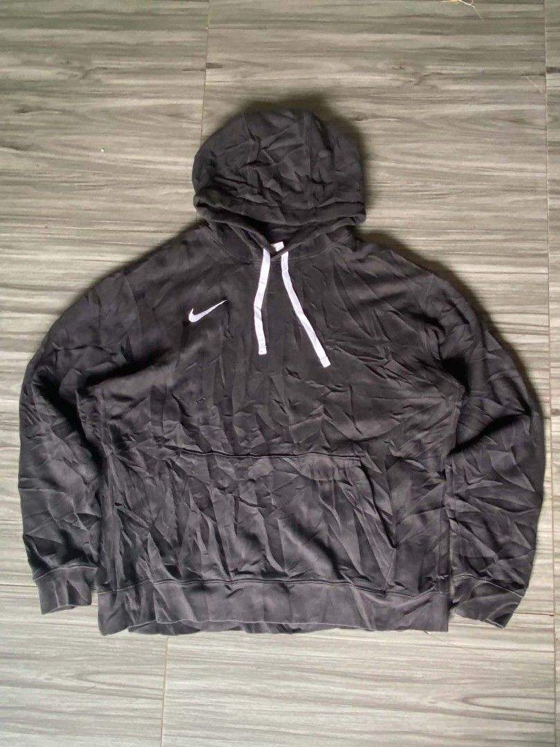 Nike Black Hoodie Size L (Category: Hoodies) located in Zamboanga. Submitted by _branskiee.thrift16 (Listing ID 1465218033, Image 1). Description: - Brand: Nike - Color: Classic Black - Size: L (Regular Fit) - Origin: Made in Thailand - Design: Pullover with white drawstring cords - Pocket: Convenient kangaroo front pocket - Branding: Small white Nike swoosh logo on the right chest - Model Code: FA210206NAY.