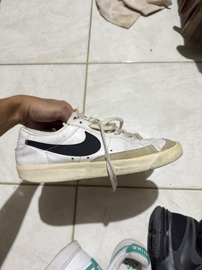 Nike Blazer Low '77 Vintage White Black (Category: Sneakers) located in Manila. Submitted by heisenbertuuu (Listing ID 1465184125, Image 1). Description: - Model: Nike Blazer Low '77 Vintage - Colorway: White with Black Swoosh - Details: Suede overlays at the toe, iconic orange Nike tongue branding, and vintage yellowed midsoles - Inclusions: Original white laces - Condition: Regular wear visible on leather uppers and soles - Style: Classic retro