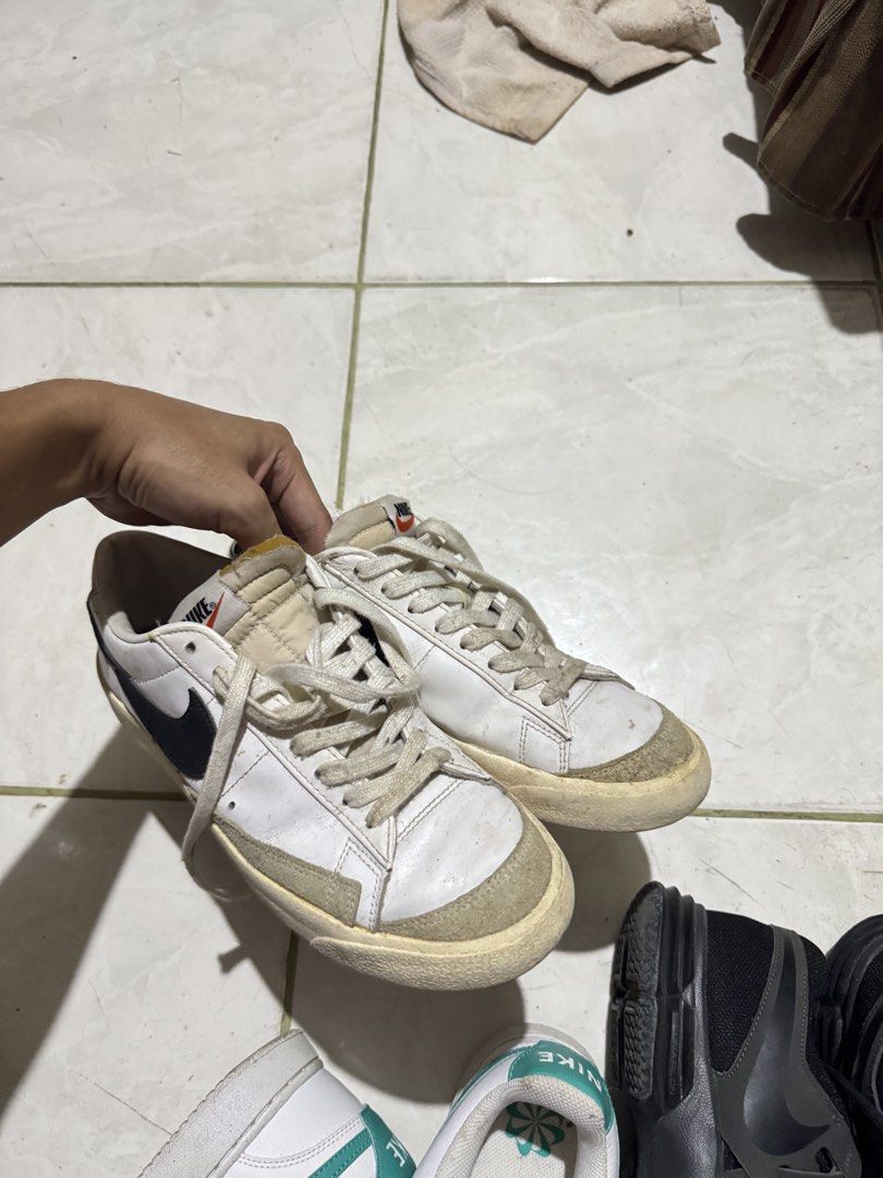 Nike Blazer Low '77 Vintage White Black (Category: Sneakers) located in Manila. Submitted by heisenbertuuu (Listing ID 1465184125, Image 2). Description: - Model: Nike Blazer Low '77 Vintage - Colorway: White with Black Swoosh - Details: Suede overlays at the toe, iconic orange Nike tongue branding, and vintage yellowed midsoles - Inclusions: Original white laces - Condition: Regular wear visible on leather uppers and soles - Style: Classic retro