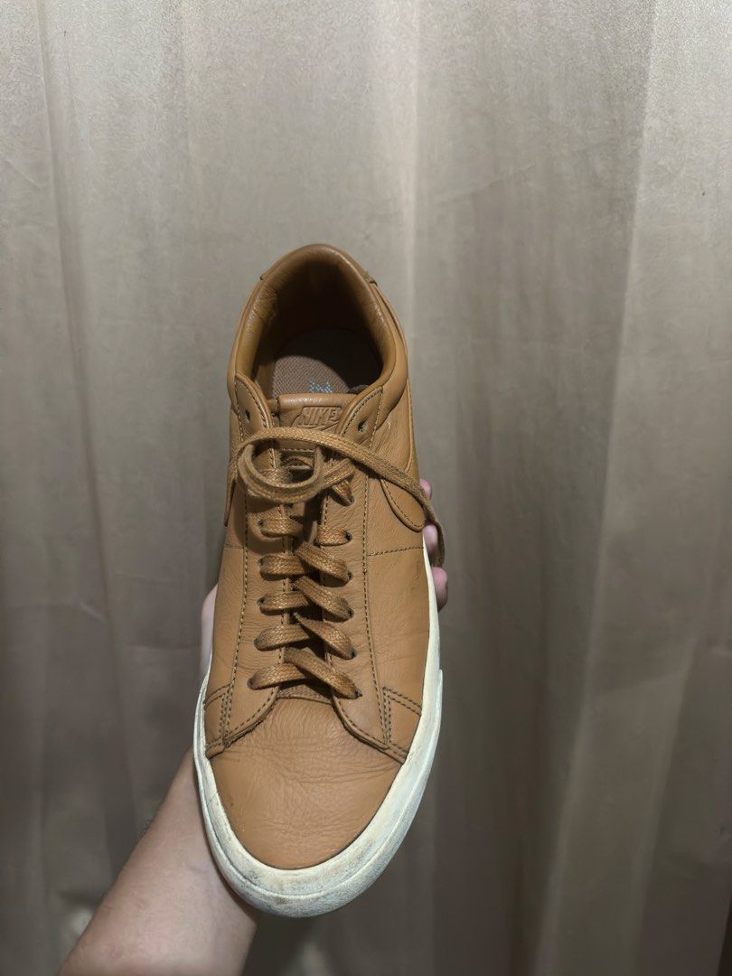 Nike Blazer Low VNTG Tan Leather Sneakers (Category: Sneakers) located in Quezon City. Submitted by bebe0827 (Listing ID 1465300751, Image 2). Description: - Brand: Nike Blazer Low - Color: Tan leather with matching brown laces and classic side swoosh - Condition: Good everyday pair with natural grain texture on the leather; white rubber midsole has minor scuffs from regular use - Style: Clean monochrome look, perfect for casual daily wear.