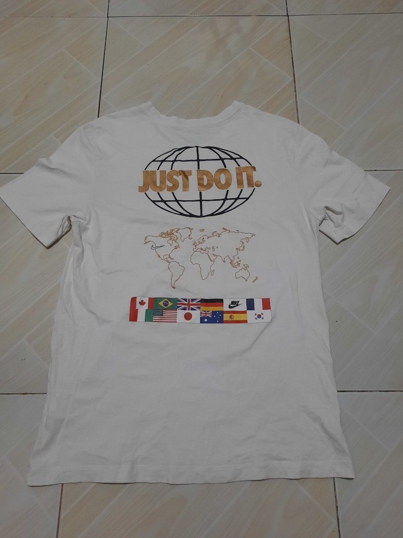 nike country graphic shirt (Category: Tshirts & Polo Shirts ) located in Tarlac. Submitted by thryftstash (Listing ID 1465349823, Image 1). Description: dimes: 26 - 18.5 M on tag issue: last pic (minimal cracks) sf not included tarlac loc j&t and lbc courier.