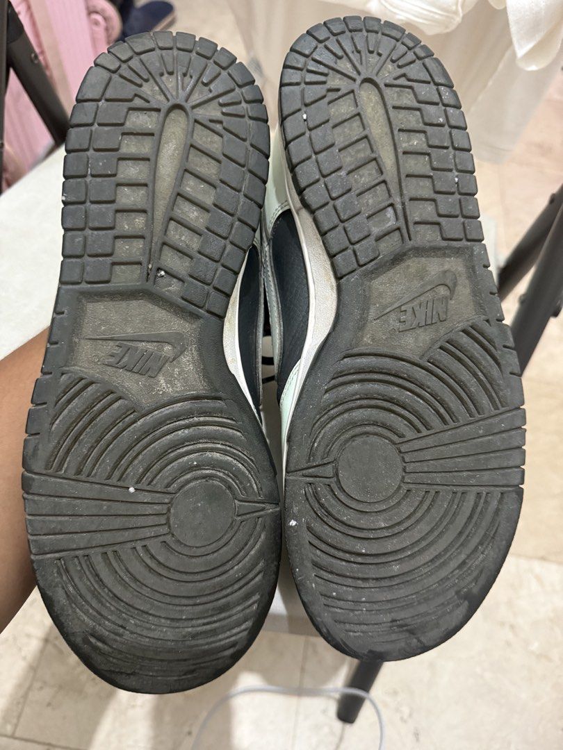 Nike Dunk Low Retro (Category: Sneakers) located in Manila. Submitted by zennzero (Listing ID 1465326225, Image 3). Description: - Brand/Model: Nike Dunk Low - Colorway: Black and Mint Green - Design: Classic low-top with black leather panels, contrast overlays, and black laces - Details: Textured tongue branding and unique distorted Nike text embroidery on heel tabs - Condition: Soles show minor wear and dirt from normal use - Perfect for daily 