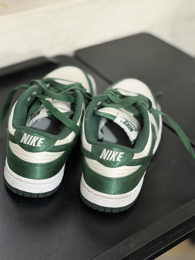 Nike Dunk Low Satin Green White Sneakers (Category: Sneakers) located in Pasig City. Submitted by momfinds23 (Listing ID 1465194738, Image 2). Description: - Model: Nike Dunk Low - Colorway: Green and White - Material: Unique glossy satin upper - Size: UK 3.5 / EUR 36.5 - Product Code: DX5931-100 - Condition: Brand new with box - Mode of Payment: Gcash / BPI / COD via shipping - Shipping: Same-day delivery available within Metro Manila.
